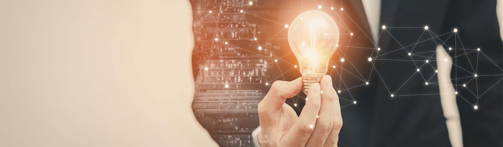 Businessman holding a lightbulb